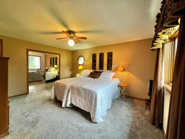 4095 125th St SE, Granite Falls, MN 56241 - bedroom with carpet, a textured ceiling, a closet, and a ceiling fan
