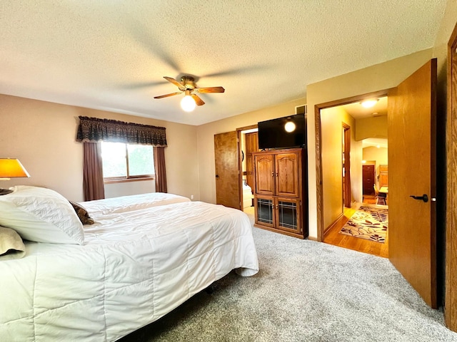 4095 125th St SE, Granite Falls, MN 56241 - bedroom with carpet flooring, a ceiling fan, and a textured ceiling