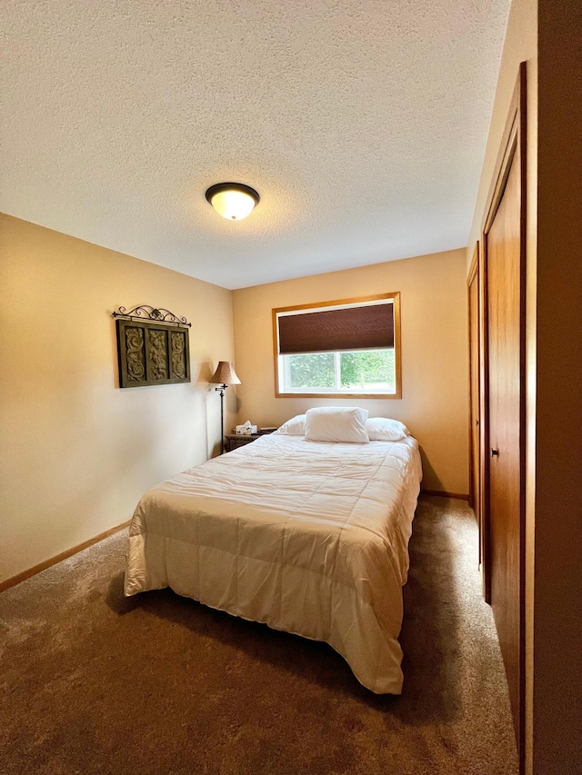 4095 125th St SE, Granite Falls, MN 56241 - bedroom featuring dark colored carpet and a textured ceiling
