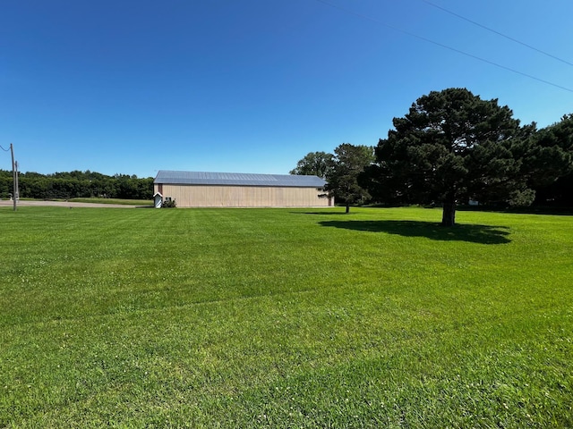 4095 125th St SE, Granite Falls, MN 56241 - view of grassy yard with a pole building and an outdoor structure