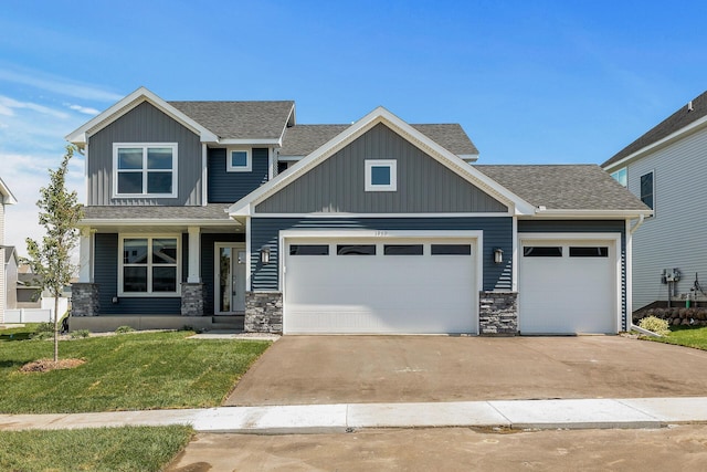 1959 Tamarack Rd, Carver, MN 55315 - craftsman-style home featuring a garage, driveway, roof with shingles, and a front yard