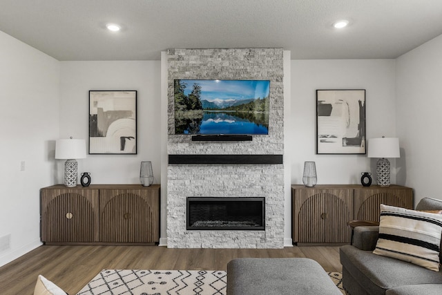 1959 Tamarack Rd, Carver, MN 55315 - living room featuring wood finished floors, a fireplace, and recessed lighting
