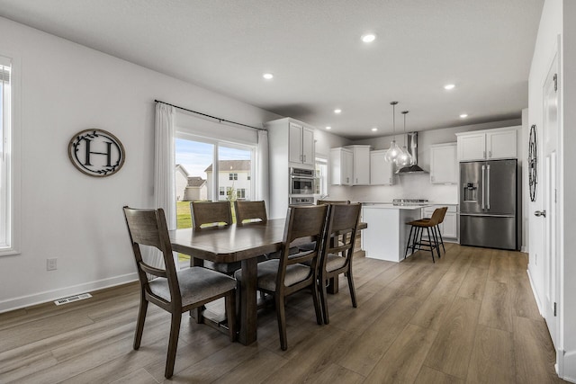 1959 Tamarack Rd, Carver, MN 55315 - dining space featuring light wood-type flooring and recessed lighting