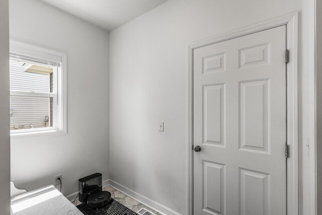 1959 Tamarack Rd, Carver, MN 55315 - interior space featuring marble look tile flooring and baseboards