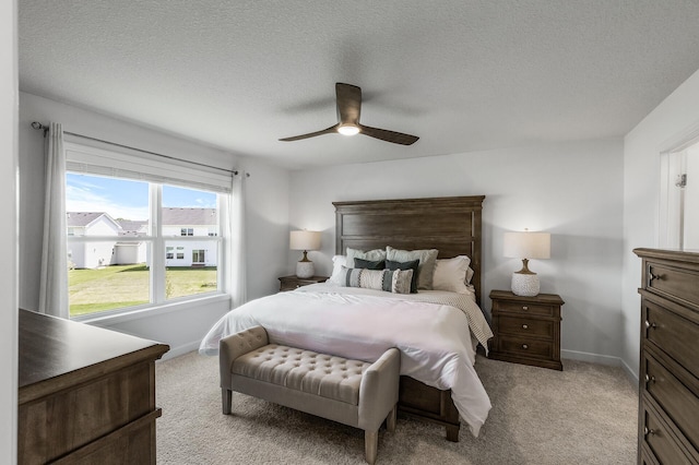 1959 Tamarack Rd, Carver, MN 55315 - bedroom with light colored carpet, a textured ceiling, and a ceiling fan