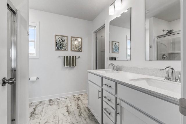 1959 Tamarack Rd, Carver, MN 55315 - full bath featuring marble finish flooring, double vanity, and a shower with door