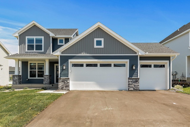 1959 Tamarack Rd, Carver, MN 55315 - craftsman inspired home with an attached garage, stone siding, driveway, and a front lawn
