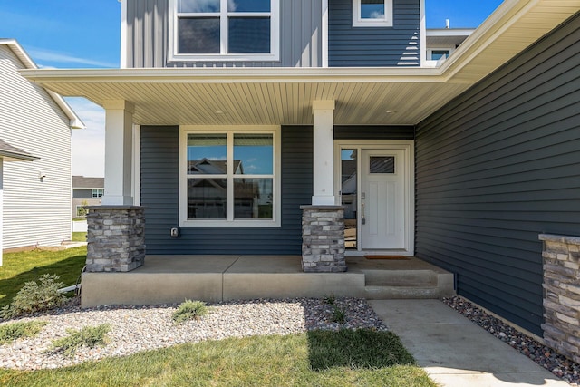 1959 Tamarack Rd, Carver, MN 55315 - property entrance featuring a porch and board and batten siding