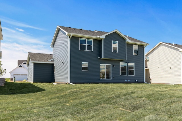 1959 Tamarack Rd, Carver, MN 55315 - rear view of property featuring a lawn and a shingled roof