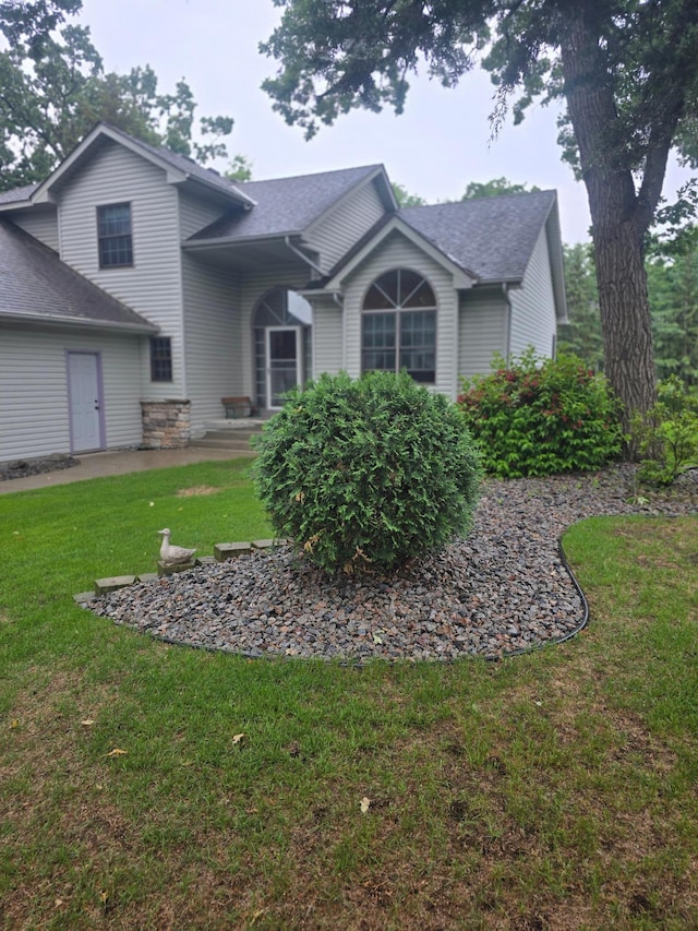2248 151st Ave NW, Andover, MN 55304 - view of front of home featuring a front lawn and roof with shingles