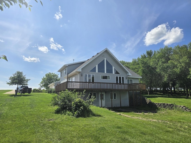 45356 140th St, Swan Lake Twp, MN 56235 - rear view of house with a wooden deck and a lawn