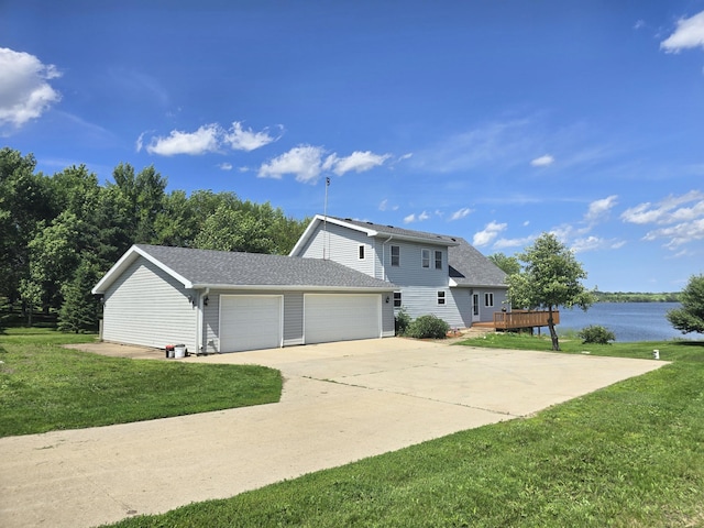 45356 140th St, Swan Lake Twp, MN 56235 - view of front of home featuring a front yard, a garage, driveway, and a shingled roof