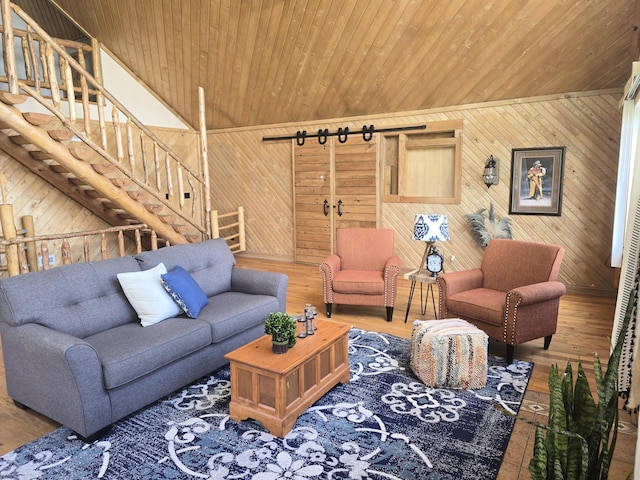 45356 140th St, Swan Lake Twp, MN 56235 - living room with wood walls, wood finished floors, stairs, and wood ceiling