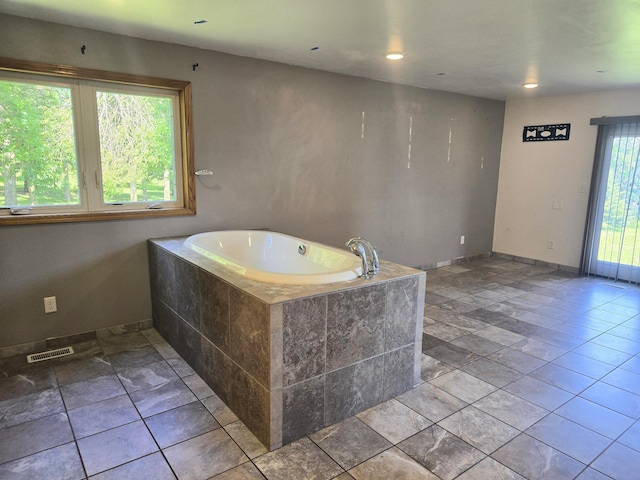 45356 140th St, Swan Lake Twp, MN 56235 - bathroom with a bath and recessed lighting