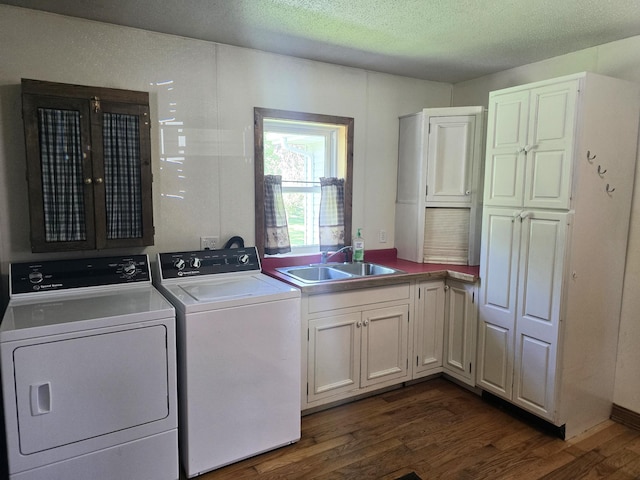 45356 140th St, Swan Lake Twp, MN 56235 - laundry area with washer and dryer, cabinet space, dark wood-style flooring, and a textured ceiling