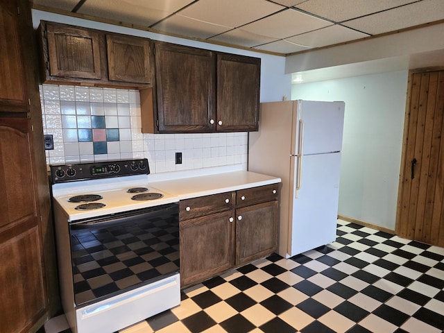 45356 140th St, Swan Lake Twp, MN 56235 - kitchen with white appliances, light floors, light countertops, dark brown cabinetry, and decorative backsplash