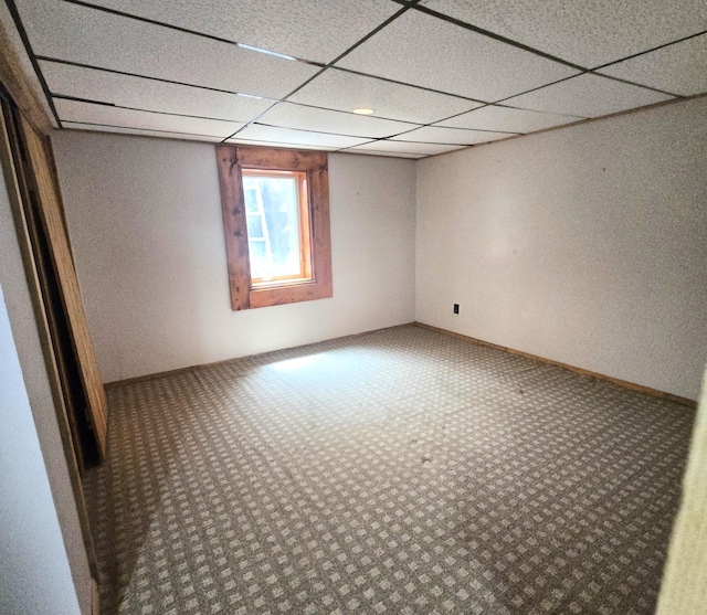 45356 140th St, Swan Lake Twp, MN 56235 - spare room featuring carpet flooring and a paneled ceiling