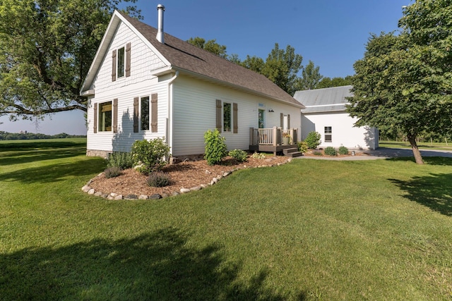 18377 County Highway 25, Fergus Falls, MN 56537 - view of home's exterior with a yard, a deck, and roof with shingles