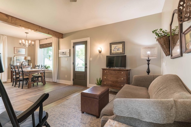 18377 County Highway 25, Fergus Falls, MN 56537 - living area with a chandelier, wood finished floors, and beamed ceiling