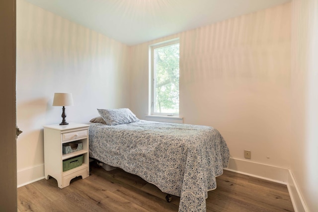 18377 County Highway 25, Fergus Falls, MN 56537 - bedroom featuring wood finished floors and multiple windows