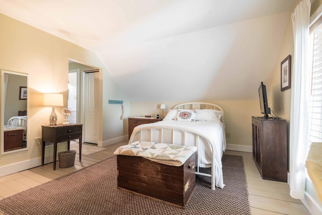18377 County Highway 25, Fergus Falls, MN 56537 - bedroom featuring vaulted ceiling and light wood finished floors