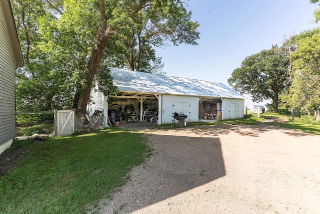 18377 County Highway 25, Fergus Falls, MN 56537 - garage with driveway and a carport