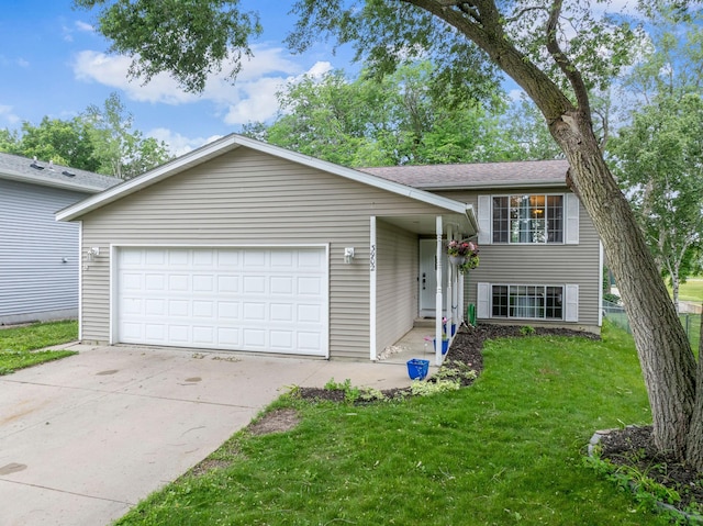 3902 Strathmore Ln SE, Rochester, MN 55904 - split level home featuring a front yard, concrete driveway, and a garage