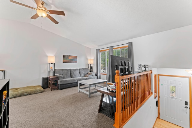 3902 Strathmore Ln SE, Rochester, MN 55904 - living area with vaulted ceiling, a ceiling fan, and light colored carpet