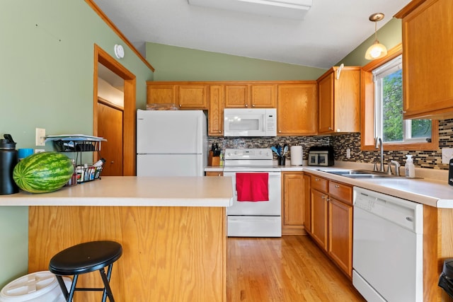 3902 Strathmore Ln SE, Rochester, MN 55904 - kitchen featuring white appliances, lofted ceiling, backsplash, a peninsula, and light wood-style floors