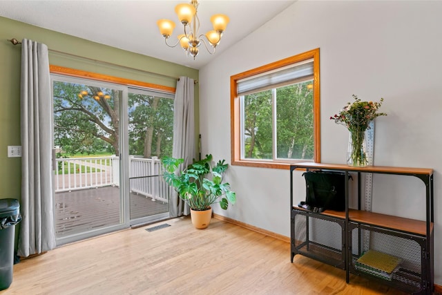 3902 Strathmore Ln SE, Rochester, MN 55904 - sitting room with a chandelier and wood finished floors