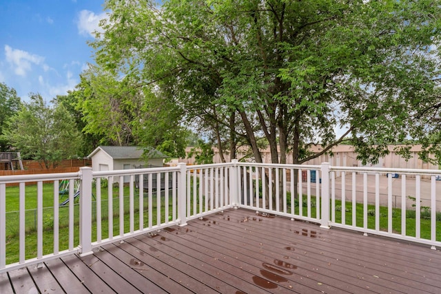3902 Strathmore Ln SE, Rochester, MN 55904 - wooden terrace featuring a fenced backyard and an outbuilding