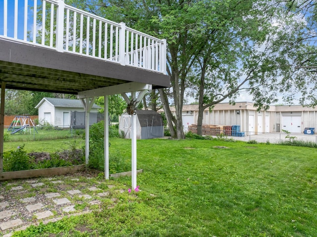 3902 Strathmore Ln SE, Rochester, MN 55904 - view of yard featuring a storage shed, a wooden deck, and a playground