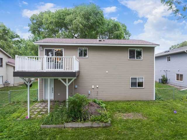 3902 Strathmore Ln SE, Rochester, MN 55904 - back of house featuring a wooden deck, a fenced backyard, and a garden