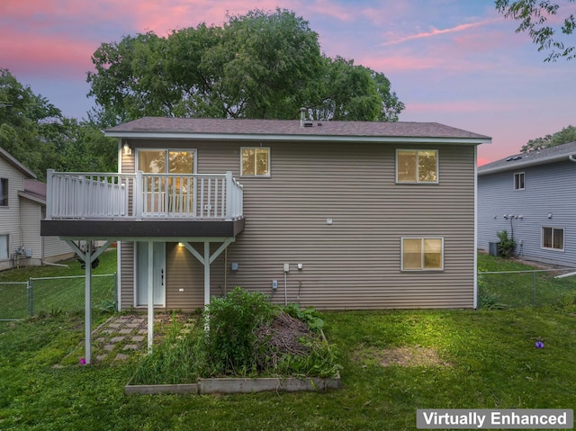 3902 Strathmore Ln SE, Rochester, MN 55904 - back of house at dusk with a deck and a garden