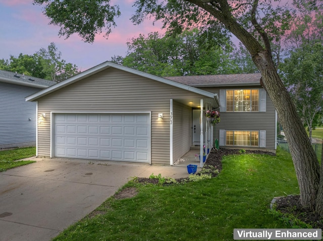 3902 Strathmore Ln SE, Rochester, MN 55904 - split level home with a lawn, driveway, and an attached garage