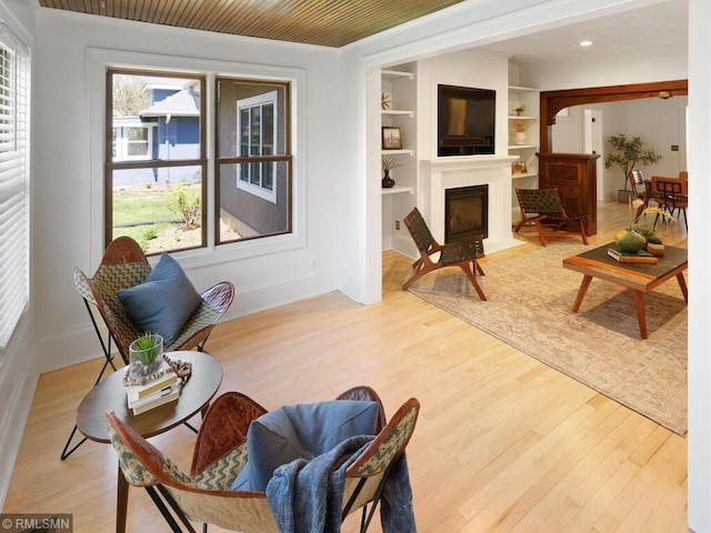 3201 Xenwood Ave S, Saint Louis Park, MN 55416 - living room featuring plenty of natural light, light wood-style floors, a fireplace with flush hearth, and built in features