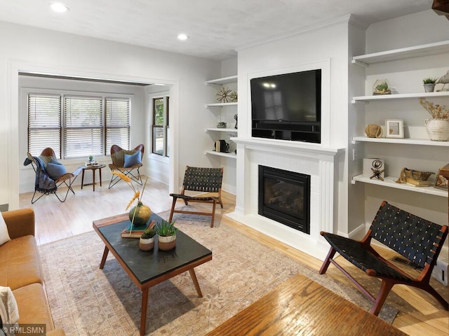 3201 Xenwood Ave S, Saint Louis Park, MN 55416 - living room with wood finished floors, a fireplace with flush hearth, recessed lighting, and built in features