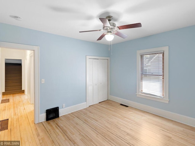3201 Xenwood Ave S, Saint Louis Park, MN 55416 - unfurnished bedroom featuring a closet, light wood finished floors, and ceiling fan