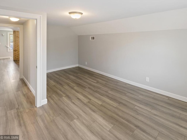 3201 Xenwood Ave S, Saint Louis Park, MN 55416 - empty room featuring wood finished floors and lofted ceiling