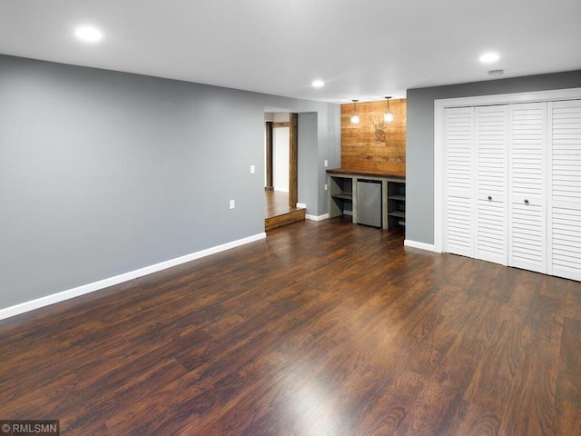 3201 Xenwood Ave S, Saint Louis Park, MN 55416 - unfurnished living room featuring recessed lighting, dark wood-style floors, and a dry bar
