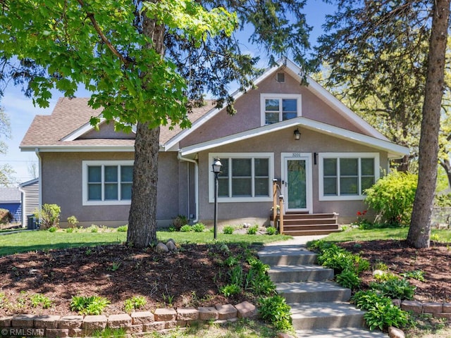 3201 Xenwood Ave S, Saint Louis Park, MN 55416 - bungalow-style home featuring stucco siding and a shingled roof