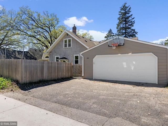 3201 Xenwood Ave S, Saint Louis Park, MN 55416 - view of home's exterior with a chimney and an outdoor structure