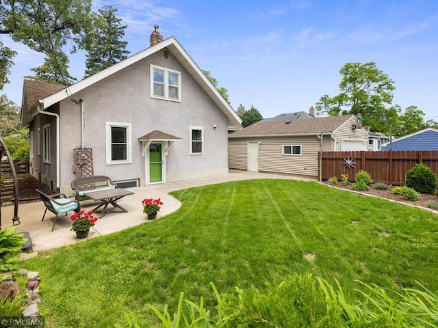 3201 Xenwood Ave S, Saint Louis Park, MN 55416 - back of property featuring stucco siding, a patio area, and a chimney