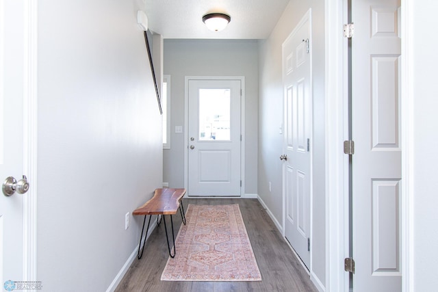 1449 68th Ave S, Fargo, ND 58104 - doorway to outside featuring wood finished floors