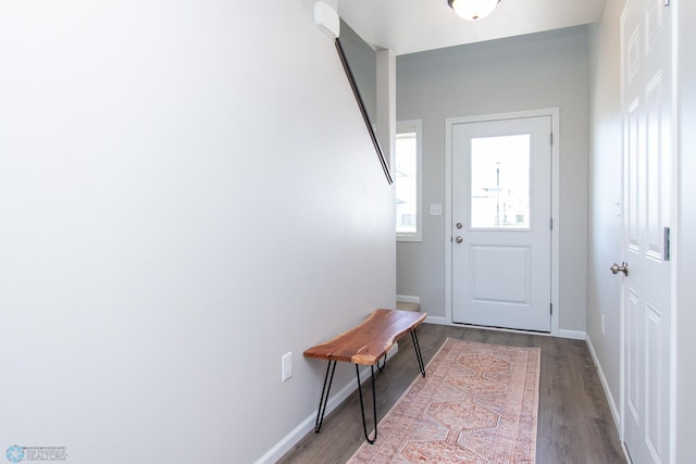 1449 68th Ave S, Fargo, ND 58104 - doorway to outside with wood finished floors and baseboards