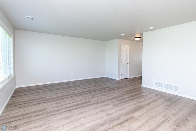 1449 68th Ave S, Fargo, ND 58104 - unfurnished room featuring wood finished floors and a smoke detector