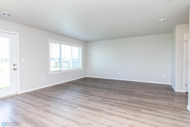 1449 68th Ave S, Fargo, ND 58104 - empty room with a smoke detector and wood finished floors