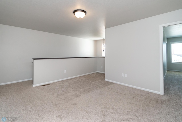 1449 68th Ave S, Fargo, ND 58104 - spare room featuring carpet flooring