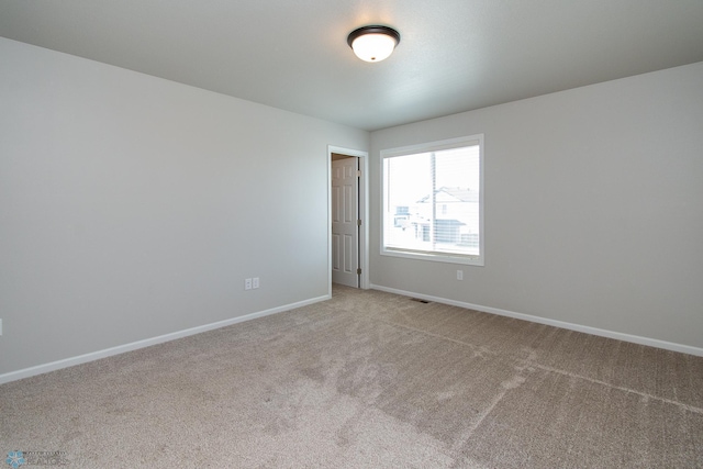 1449 68th Ave S, Fargo, ND 58104 - spare room with light colored carpet and baseboards
