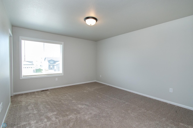 1449 68th Ave S, Fargo, ND 58104 - unfurnished room featuring carpet and baseboards